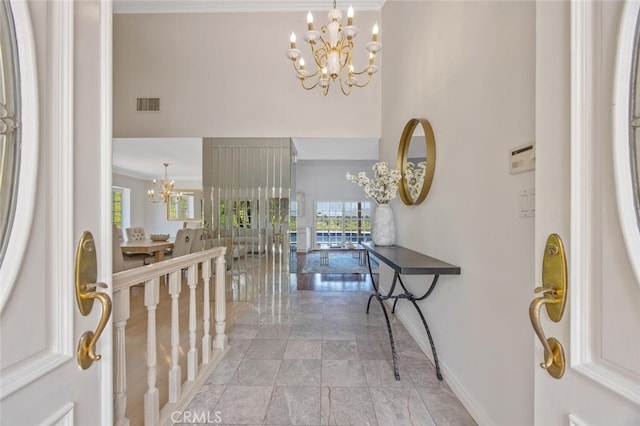 2039 Channelford Rd, Westlake Village, CA 91361 - foyer entrance with a chandelier and crown molding