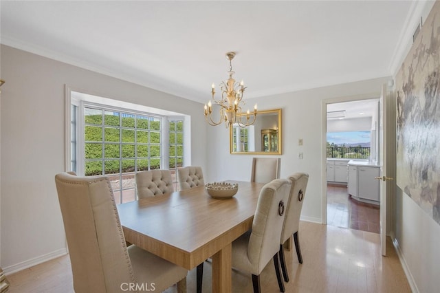 2039 Channelford Rd, Westlake Village, CA 91361 - dining room featuring a chandelier, healthy amount of natural light, light wood-style floors, and crown molding