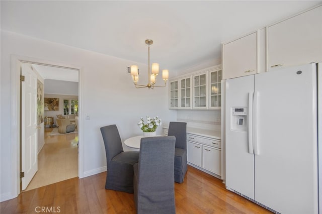 2039 Channelford Rd, Westlake Village, CA 91361 - dining area with light wood-type flooring and a chandelier