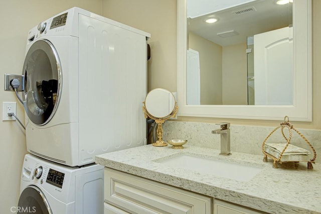 271 Avenida Sevilla Unit P, Laguna Woods, CA 92637 - laundry area featuring stacked washer / dryer and recessed lighting