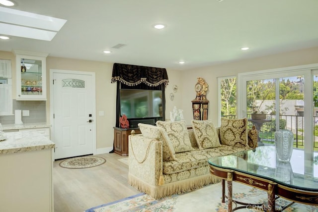 271 Avenida Sevilla Unit P, Laguna Woods, CA 92637 - living room with light wood-style flooring, recessed lighting, and a skylight