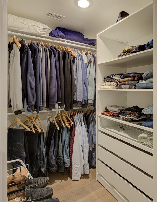 271 Avenida Sevilla Unit P, Laguna Woods, CA 92637 - walk in closet featuring light wood finished floors