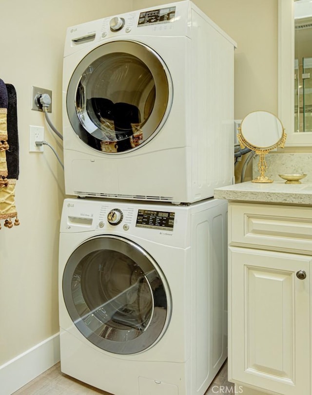 271 Avenida Sevilla Unit P, Laguna Woods, CA 92637 - washroom with stacked washer / dryer and cabinet space