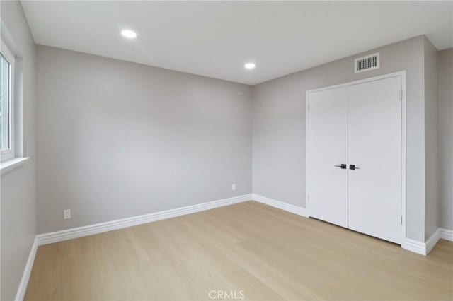 4203 Tolowa St, San Diego, CA 92117 - unfurnished bedroom with light wood-style flooring, recessed lighting, and a closet