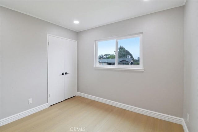 4203 Tolowa St, San Diego, CA 92117 - unfurnished bedroom with light wood-style floors, recessed lighting, and a closet
