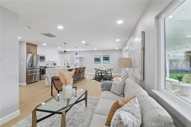 4203 Tolowa St, San Diego, CA 92117 - living room featuring recessed lighting and light wood-type flooring