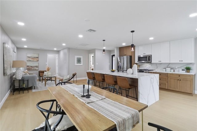 4203 Tolowa St, San Diego, CA 92117 - dining area featuring light wood-style flooring and recessed lighting