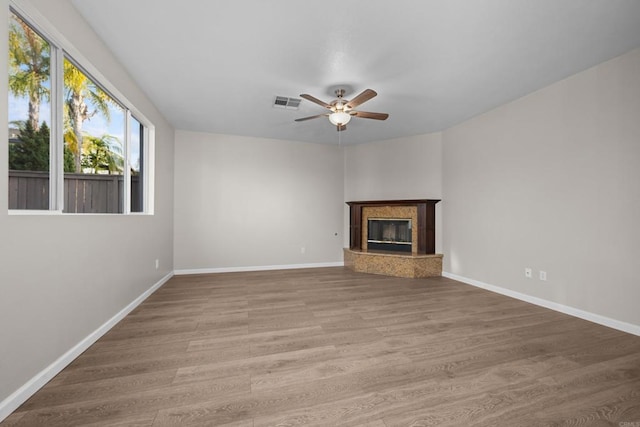 1347 Vallejo Mills St, Chula Vista, CA 91913 - unfurnished living room with ceiling fan, a high end fireplace, and wood finished floors