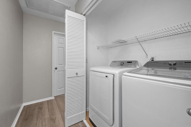 1347 Vallejo Mills St, Chula Vista, CA 91913 - laundry area with separate washer and dryer and light wood-style flooring