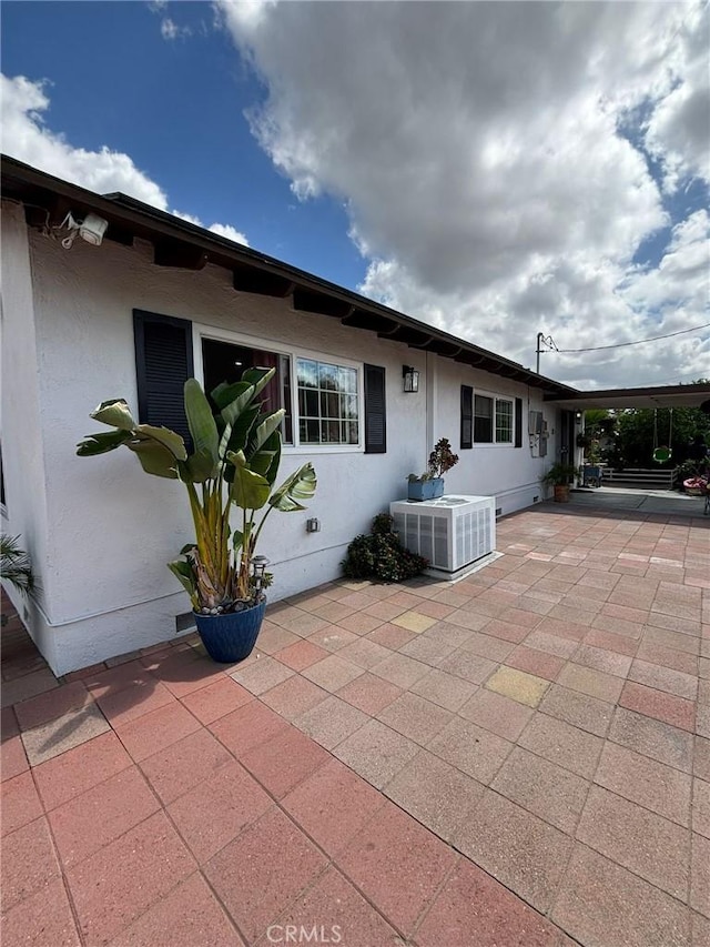 2835 Etiwanda Ave, Rialto, CA 92376 - rear view of house with a patio area and stucco siding