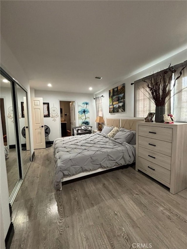 2835 Etiwanda Ave, Rialto, CA 92376 - bedroom featuring light wood-type flooring, washer / dryer, and recessed lighting