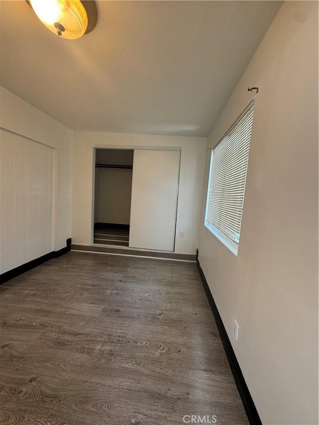 2835 Etiwanda Ave, Rialto, CA 92376 - unfurnished bedroom featuring dark wood-type flooring and a closet