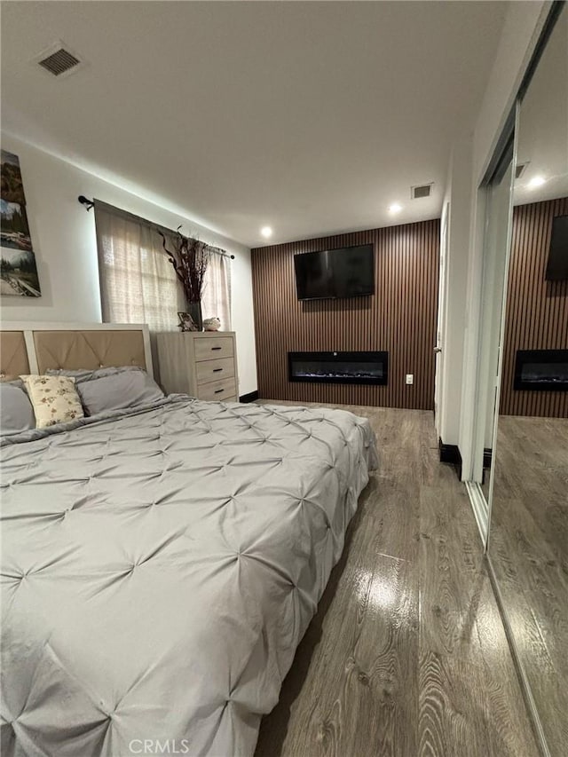 2835 Etiwanda Ave, Rialto, CA 92376 - bedroom with a fireplace and wood finished floors