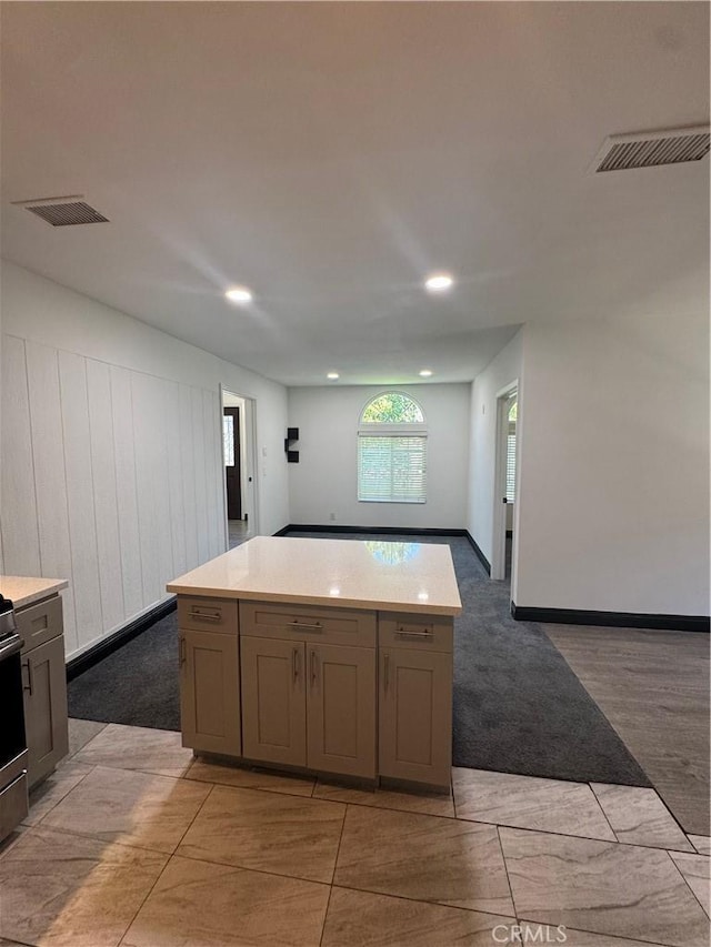 2835 Etiwanda Ave, Rialto, CA 92376 - kitchen featuring light countertops, recessed lighting, a kitchen island, and open floor plan
