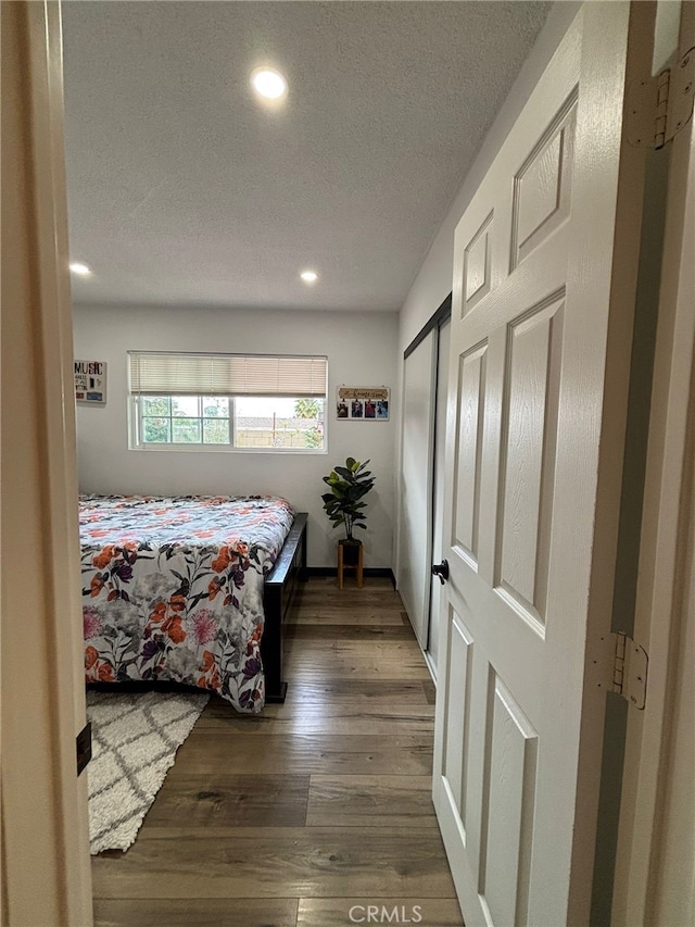 2835 Etiwanda Ave, Rialto, CA 92376 - bedroom featuring a textured ceiling, recessed lighting, and wood finished floors