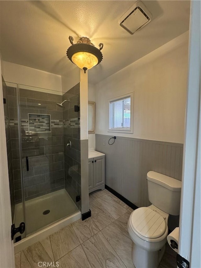 2835 Etiwanda Ave, Rialto, CA 92376 - full bathroom with vanity, a shower stall, and wainscoting
