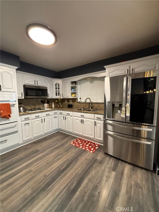 2835 Etiwanda Ave, Rialto, CA 92376 - kitchen with appliances with stainless steel finishes, a warming drawer, dark wood-style floors, and white cabinets