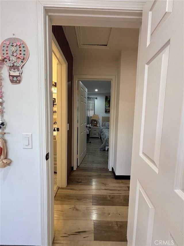 2835 Etiwanda Ave, Rialto, CA 92376 - hallway featuring wood-type flooring and attic access