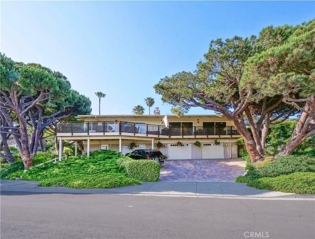 3530 Spearing Ave, San Pedro, CA 90732 - view of front of house featuring an attached garage, driveway, and a balcony
