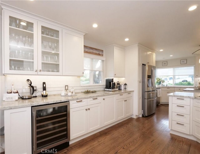 3530 Spearing Ave, San Pedro, CA 90732 - bar featuring beverage cooler, appliances with stainless steel finishes, healthy amount of natural light, dark wood-type flooring, and recessed lighting