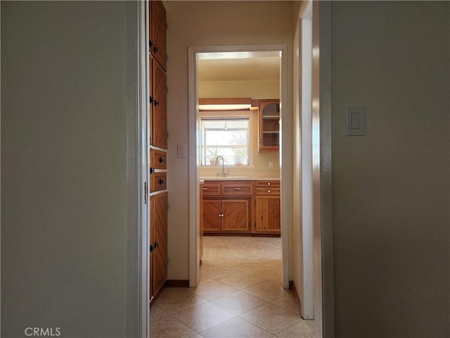 16708 Lawnwood St, La Puente, CA 91744 - hallway with a sink and light tile patterned floors