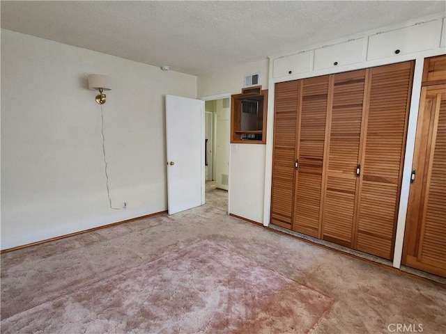 16708 Lawnwood St, La Puente, CA 91744 - unfurnished bedroom with carpet flooring, a textured ceiling, and a closet
