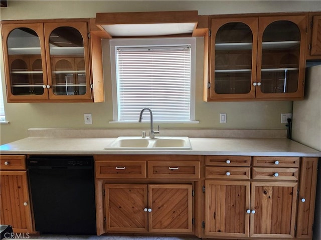 16708 Lawnwood St, La Puente, CA 91744 - kitchen featuring dishwasher, light countertops, brown cabinetry, and glass insert cabinets