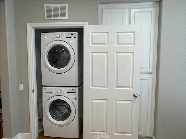 896 Poppyseed Way, Hemet, CA 92545 - laundry room featuring stacked washing machine and dryer and baseboards