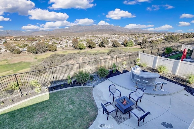 35212 Smith Ave, Beaumont, CA 92223 - fenced backyard featuring a fire pit, a patio area, and a mountain view