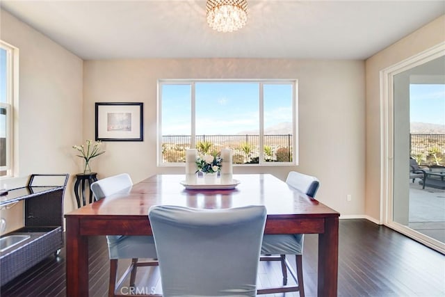 35212 Smith Ave, Beaumont, CA 92223 - dining area featuring dark wood-type flooring and a chandelier