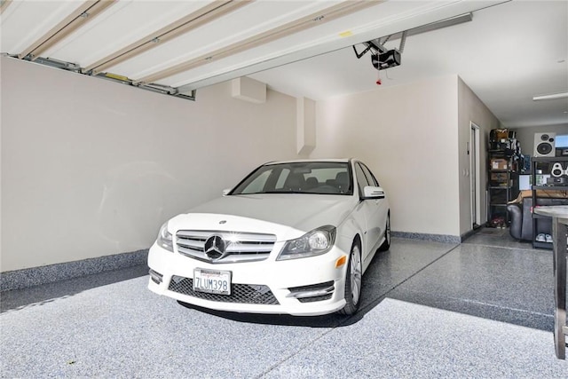 35212 Smith Ave, Beaumont, CA 92223 - garage with baseboards and a garage door opener