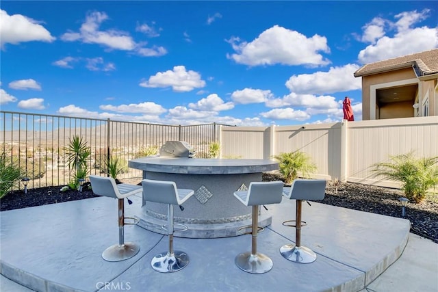 35212 Smith Ave, Beaumont, CA 92223 - fenced backyard featuring a patio area and an outdoor kitchen