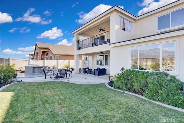 35212 Smith Ave, Beaumont, CA 92223 - back of property with a balcony, ceiling fan, outdoor lounge area, and stucco siding