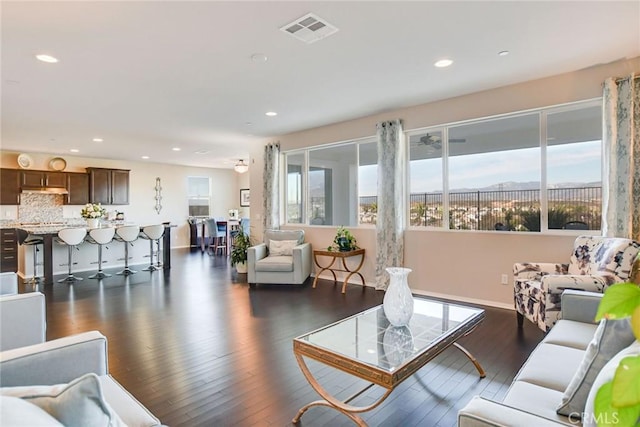 35212 Smith Ave, Beaumont, CA 92223 - living area with healthy amount of natural light, recessed lighting, and dark wood-style floors