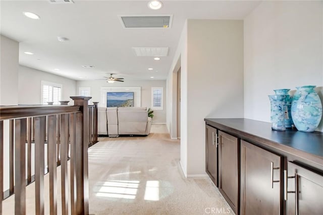 35212 Smith Ave, Beaumont, CA 92223 - corridor with light carpet, recessed lighting, and an upstairs landing