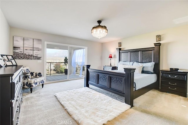 35212 Smith Ave, Beaumont, CA 92223 - bedroom featuring carpet flooring, access to exterior, and a chandelier
