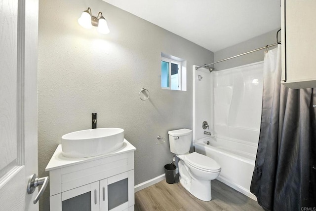 493133 Auburn, San Diego, CA 92105 - full bathroom featuring wood finished floors, shower / bathtub combination with curtain, and vanity