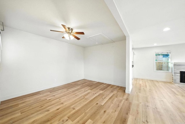 493133 Auburn, San Diego, CA 92105 - unfurnished living room with attic access, ceiling fan, light wood-style floors, a fireplace, and recessed lighting