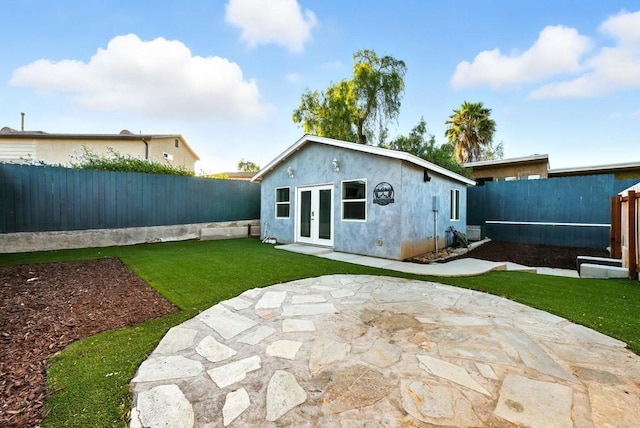493133 Auburn, San Diego, CA 92105 - rear view of property with french doors, a fenced backyard, stucco siding, and a patio