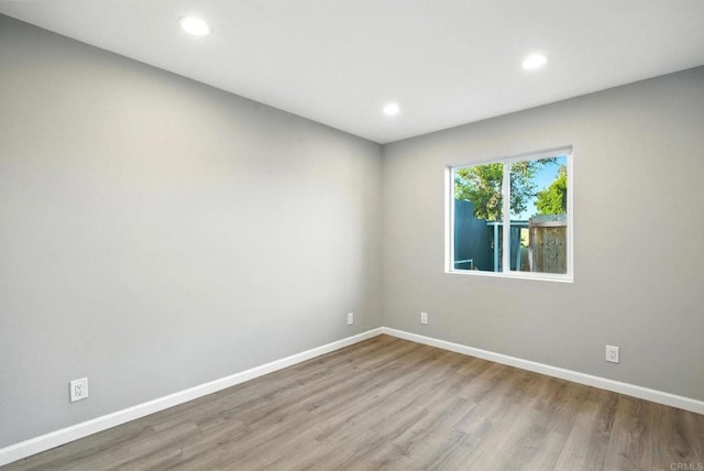 493133 Auburn, San Diego, CA 92105 - empty room featuring wood finished floors and recessed lighting