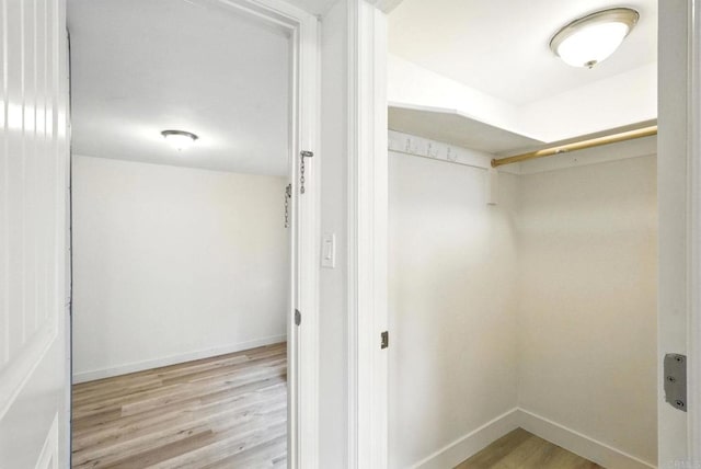493133 Auburn, San Diego, CA 92105 - walk in closet featuring light wood-type flooring