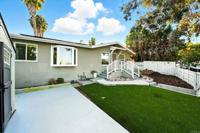 493133 Auburn, San Diego, CA 92105 - view of front facade featuring stucco siding and a patio area