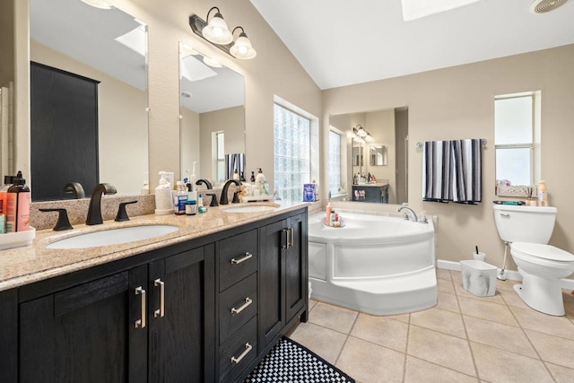 1067 Stevenson St Unit A & B, Colton, CA 92324 - full bathroom featuring a bath, vaulted ceiling, tile patterned flooring, and double vanity