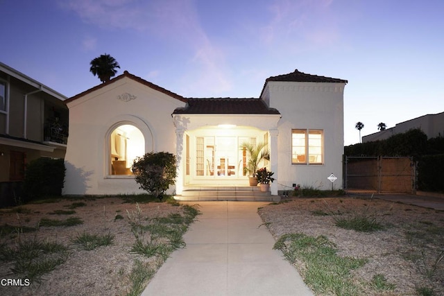 317 N Primrose Ave, Alhambra, CA 91801 - view of front facade with stucco siding and a gate