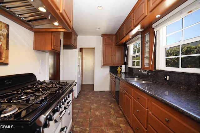 317 N Primrose Ave, Alhambra, CA 91801 - kitchen featuring gas range oven, wall chimney range hood, dark stone counters, dishwasher, and brown cabinetry