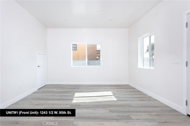 1241 W 95th St, Los Angeles, CA 90044 - spare room featuring wood finished floors and baseboards