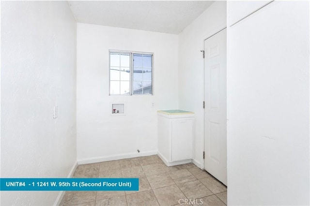 1241 W 95th St, Los Angeles, CA 90044 - washroom featuring cabinet space, hookup for a washing machine, and light tile patterned floors