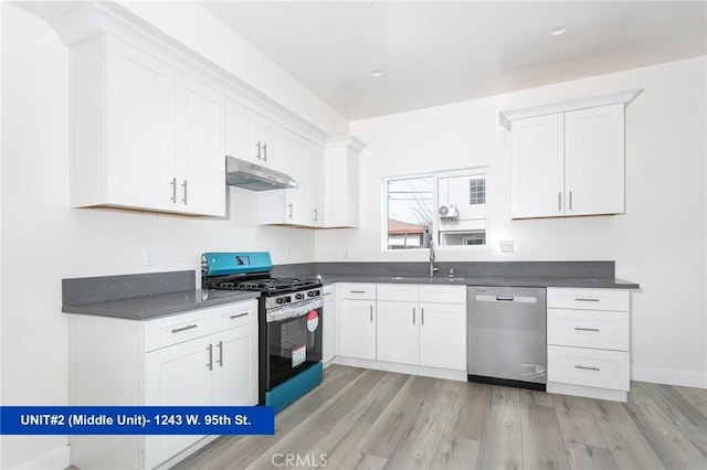 1241 W 95th St, Los Angeles, CA 90044 - kitchen with appliances with stainless steel finishes, dark countertops, light wood-style flooring, under cabinet range hood, and white cabinets