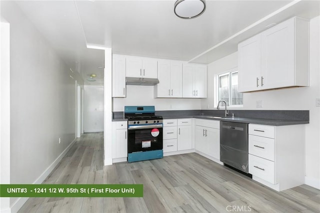 1241 W 95th St, Los Angeles, CA 90044 - kitchen with appliances with stainless steel finishes, under cabinet range hood, dark countertops, light wood-style flooring, and white cabinetry