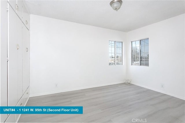 1241 W 95th St, Los Angeles, CA 90044 - unfurnished bedroom with wood finished floors